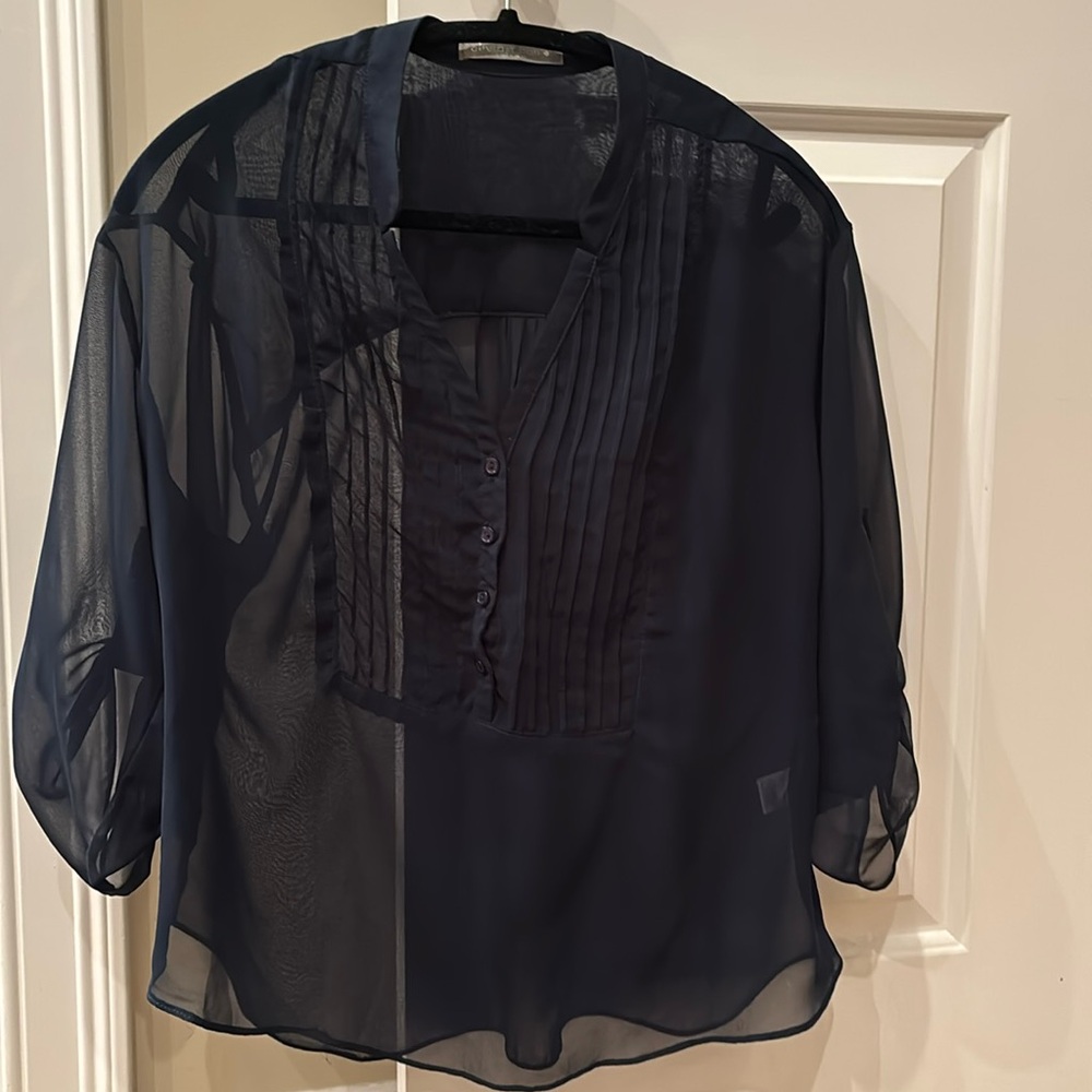GUC. Olivia Moon. Sheer navy blouse with pleats,  buttons and roll up sleeves.